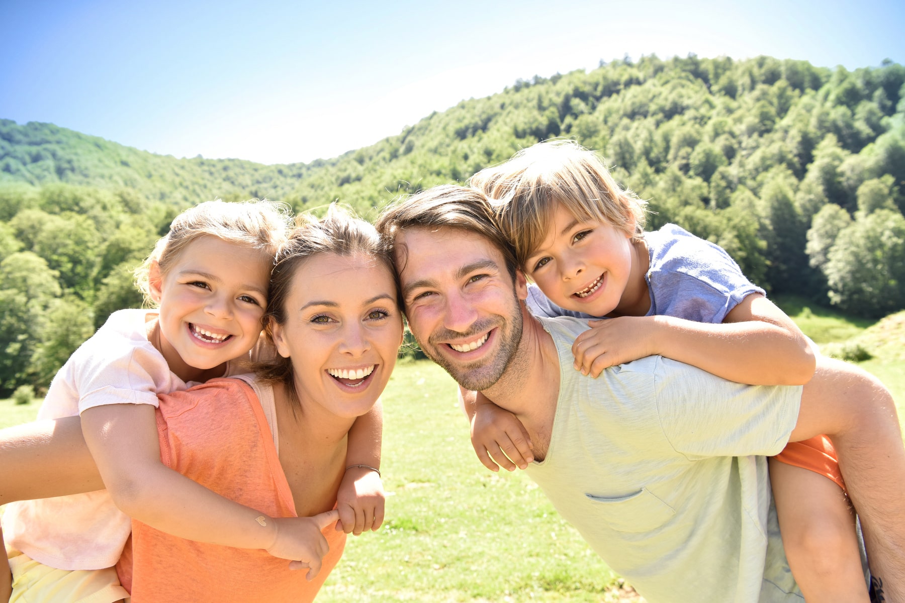 TeethCleaning1_AdobeStock_115641632_1800x1200-min family of patients happy with the teeth cleanings from Firm Foundation Dental in Prosper TX