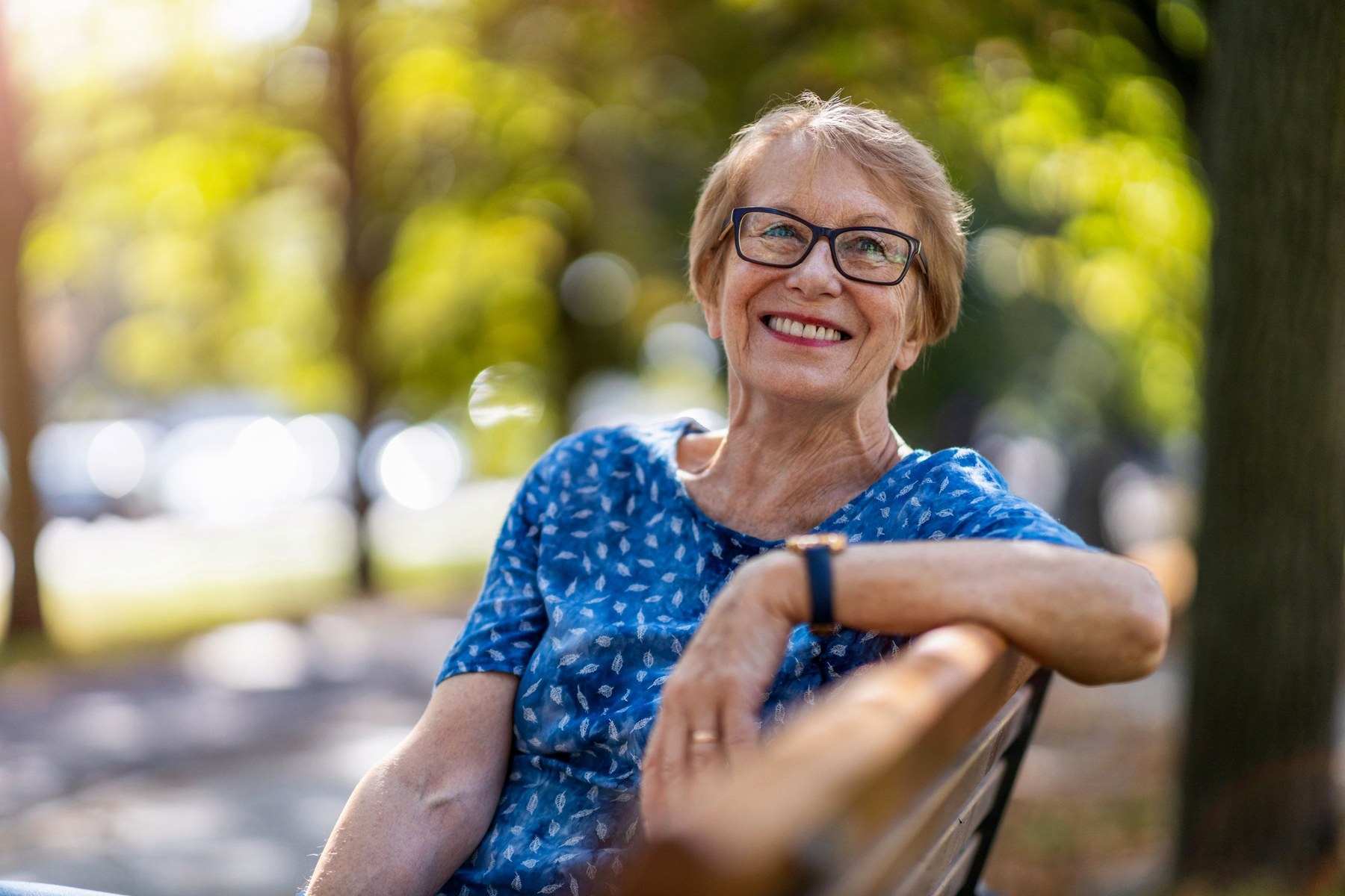Senior adult smiling after getting an oral cancer screening at Firm Foundation Dental in Prosper, TX